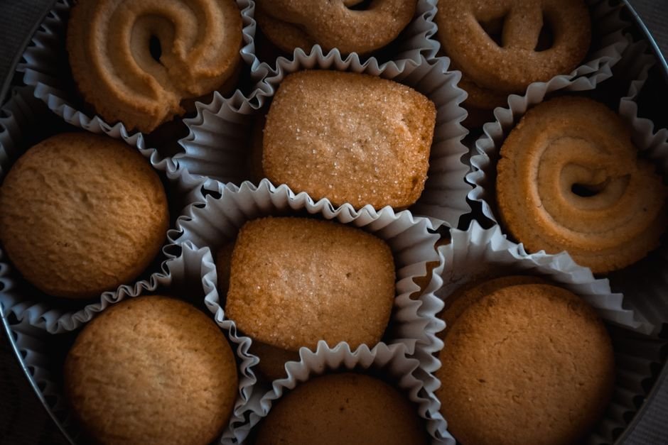 Assorted butter cookies arranged in a gift tin