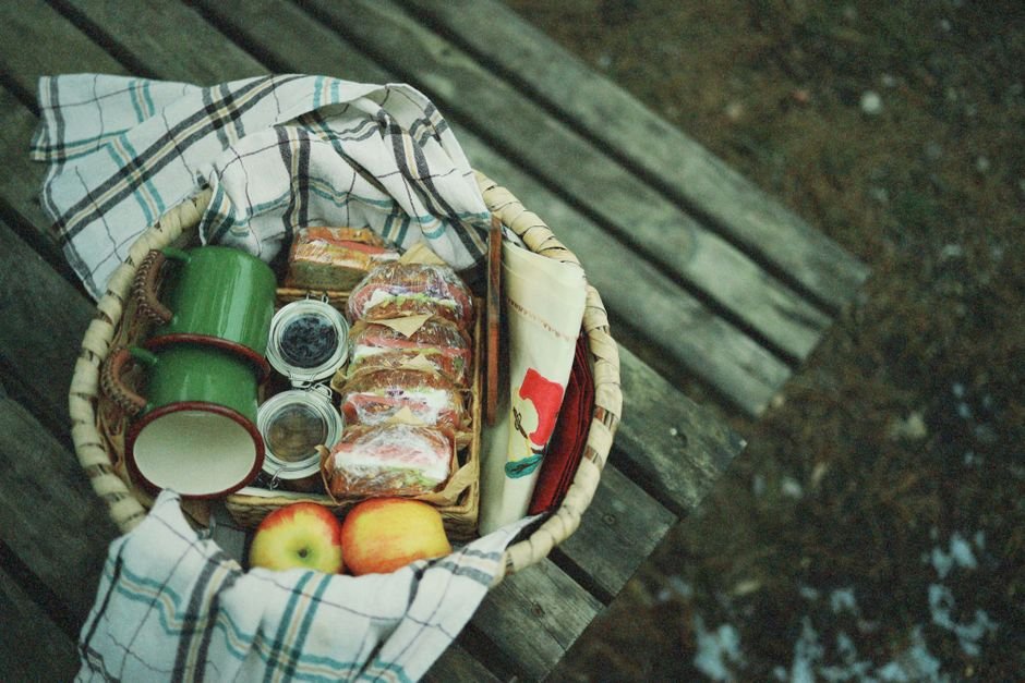 A varied gift basket for men packed for an outdoor picnic, beyond the usual beer theme