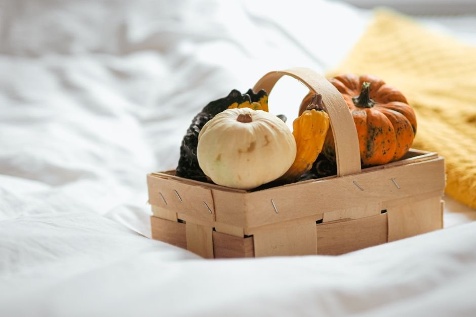 Wooden basket with assorted pumpkins for a Thanksgiving corporate gift