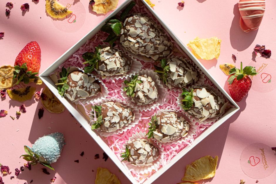 Chocolate covered strawberries topped with almond flakes
