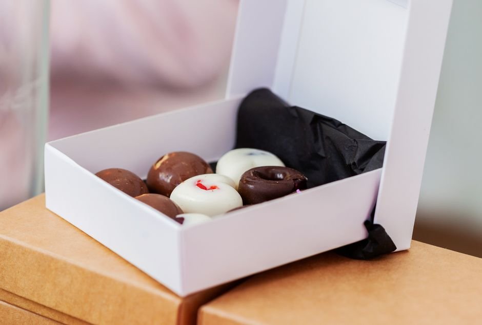 Assorted chocolate treats packed in an exam care package box