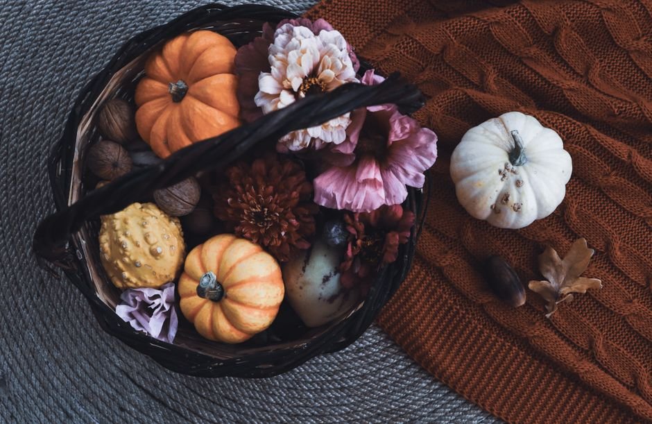 Fall basket filled with mini pumpkins and flowers for a romantic boo basket touch
