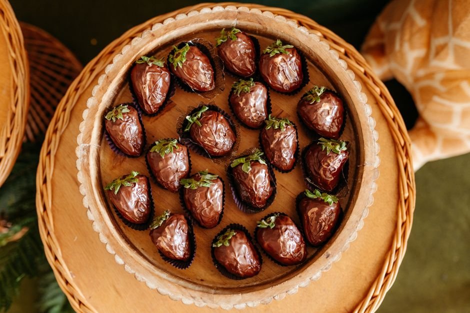 Chocolate covered strawberries arranged in a wicker container