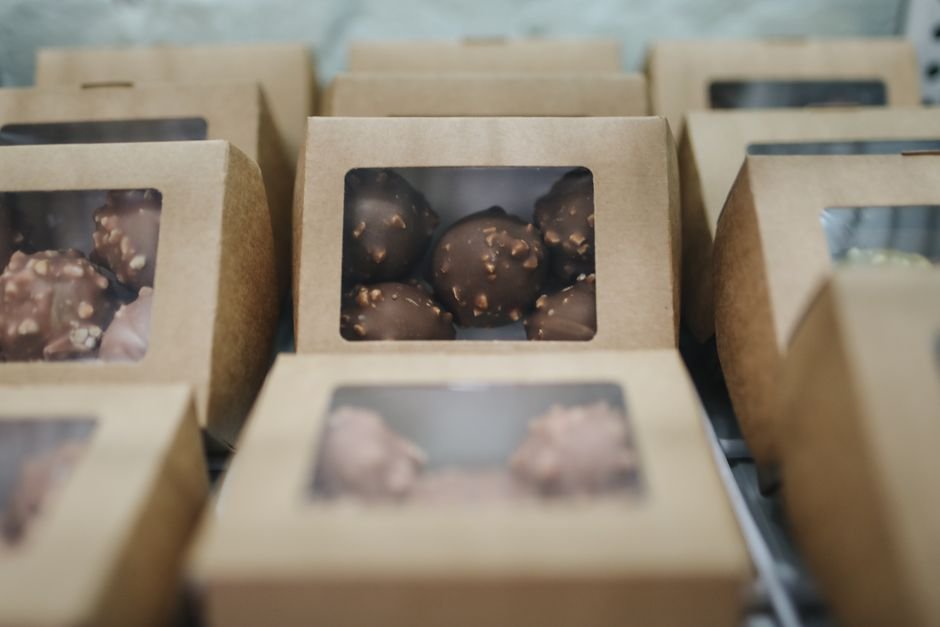 A boxed chocolate truffle similar in style to Dorda