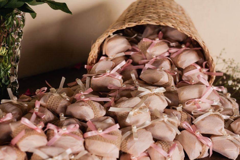 Wedding favors arranged in a basket, the kind of themed touch that works for gifts for newlyweds
