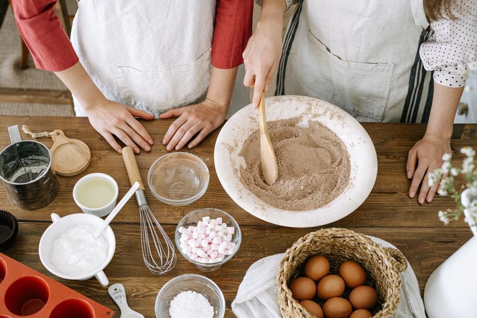 Two people baking together, the kind of hobby gift ideas for bakers should support