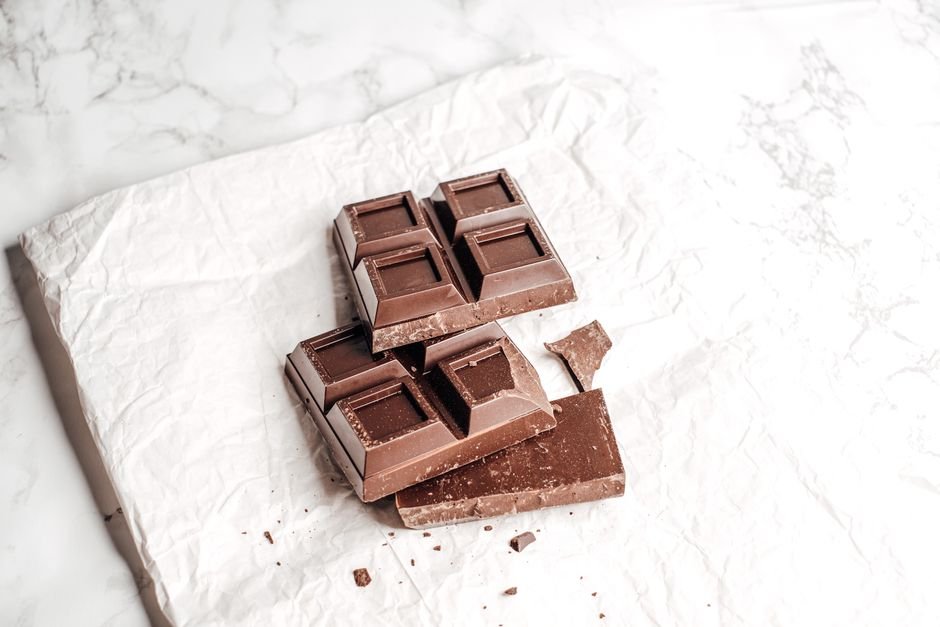 A broken dark chocolate bar similar to Ghirardelli Intense Dark