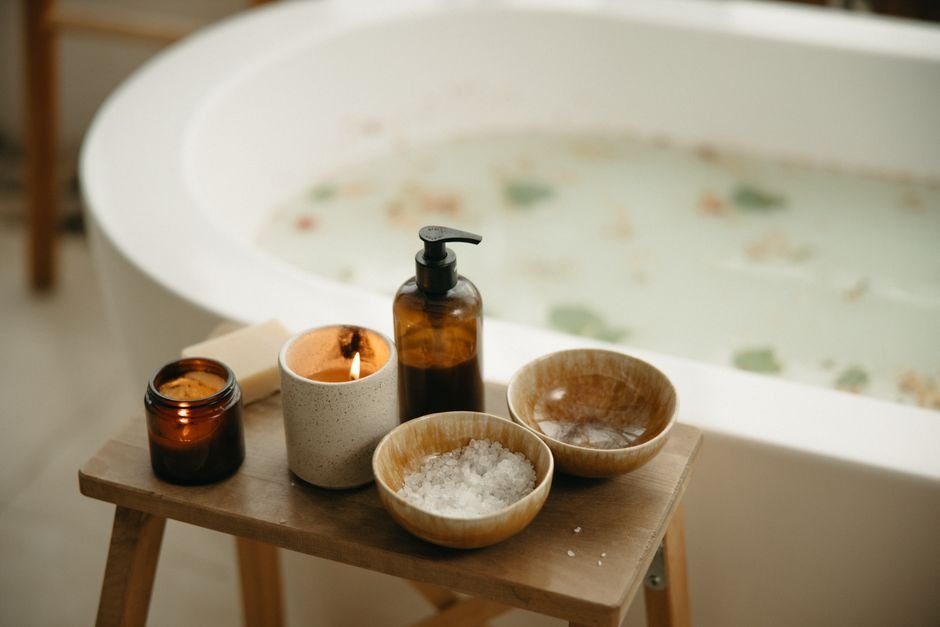Candles and bath salts set up for a spa gift basket