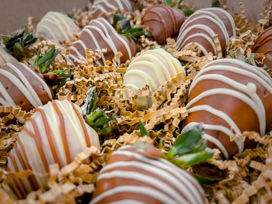 Assorted chocolate dipped strawberries with drizzled patterns