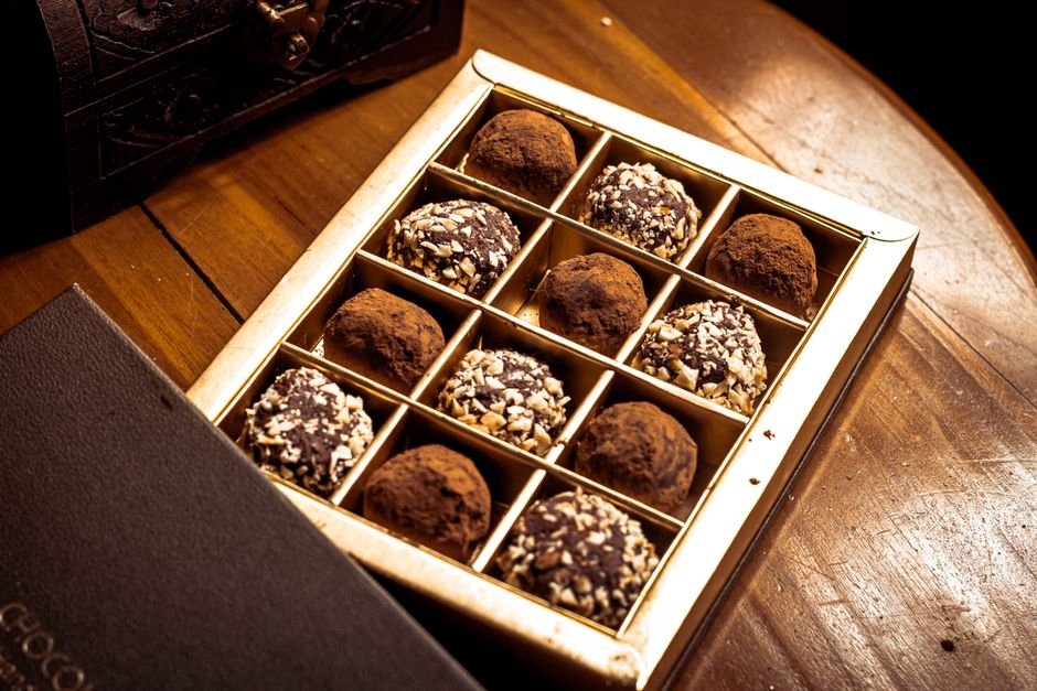 A gift box of chocolate truffles in the elegant style Godiva Truffles is known for